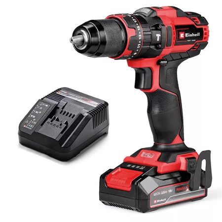 Red and black cordless drill with battery and charger on a white background